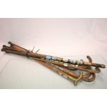 Collection of eight walking sticks to include two silver collar sticks Birmingham 1911 & 1919