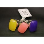 Three modern designer silver rings set with large coloured stones