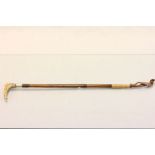 Silver collared Bamboo riding crop with carved Horn handle
