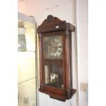 Oak cased key wind wall clock with glazed panels to the front