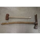 A vintage Spanish grub axe and sledge hammer together with a Rustic Sieve