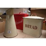 Two Enamel bread bins and an Enamel water jug