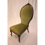Victorian Mahogany Carved Large Spoon Back Nursing Chair with green stuffed back and seat, carved