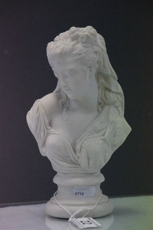 Parian bust of a female with flowers in her hair