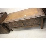 Oak Coffer with Heavily Carved Lid and Panelled Sides