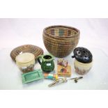 Lidded wicker basket with a group of collectables to include a Torquay ware puzzle jug