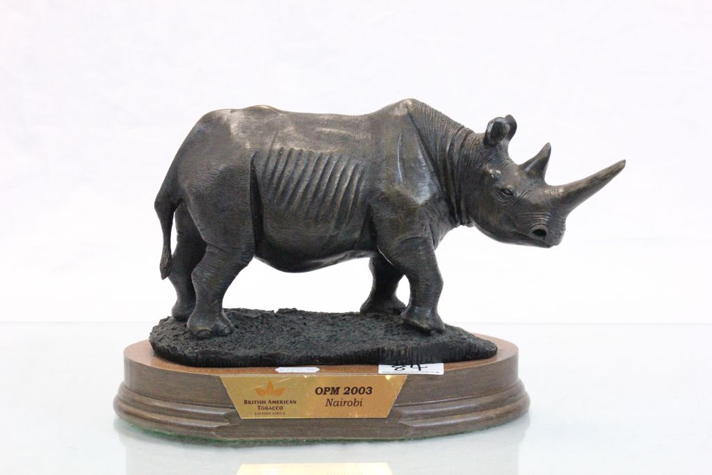 Heavy cast rhino on wooden plinth presented by British American Tobacco Nairobi 2003