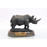 Heavy cast rhino on wooden plinth presented by British American Tobacco Nairobi 2003