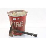 Red painted metal bucket with "Fire" painted on the side in white and an RAF fire Axe