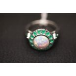 A silver ring with large centre opal