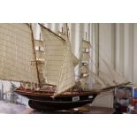 Two scratch built sailing ships on stands.