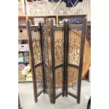 Pair of Hardwood Four Fold Screens, each with Scrolled Iron Panels