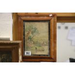 A maple framed watercolour pastoral scene with country folk, dog and sheep. Signed with monogram