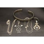 Two silver pendants on chains and a silver bangle
