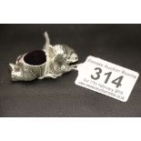 A large silver elephant shaped pin cushion