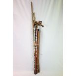 Collection of walking sticks, golf clubs, Wooden Long Measure, etc