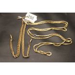A gold plated double albert watch chain together with a long chain, pierce star chain link