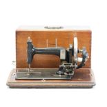 Vintage wooden cased sewing machine for Shoolbred & Co