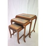 Nest of Three Teak Oriental Tables, each with carved tops