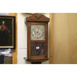 Oak cased key wind wall clock with glazed panels to the front