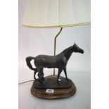 Electric lamp with Bronze effect horse on wooden plinth base