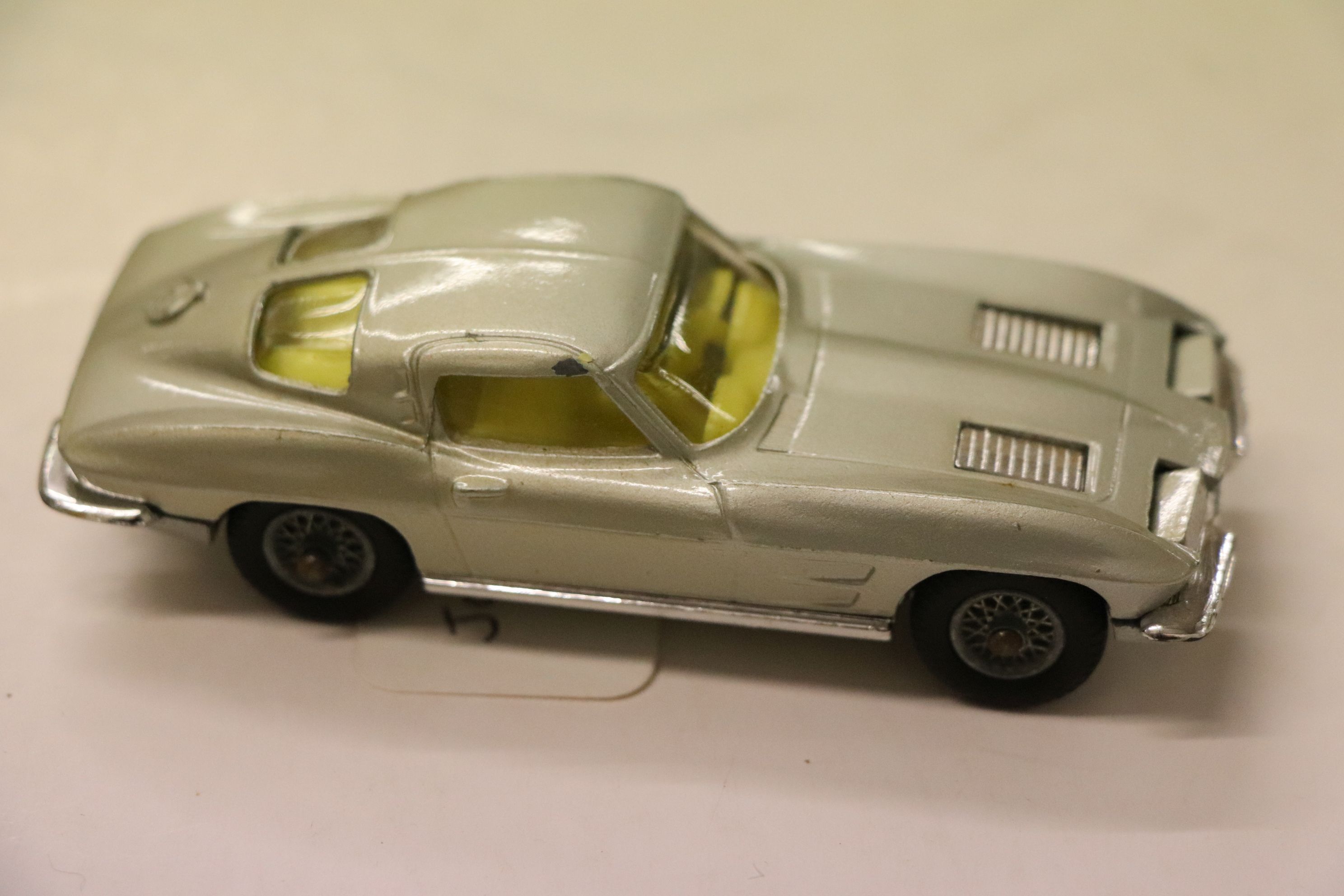 Boxed Corgi 310 Chevrolet Corvette Sting Ray in silver with yellow interior, diecast excellent,