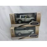 Two boxed 1:18 Grandes Marques ERTL Collectables models to include LRO0752SLNS Range Rover and