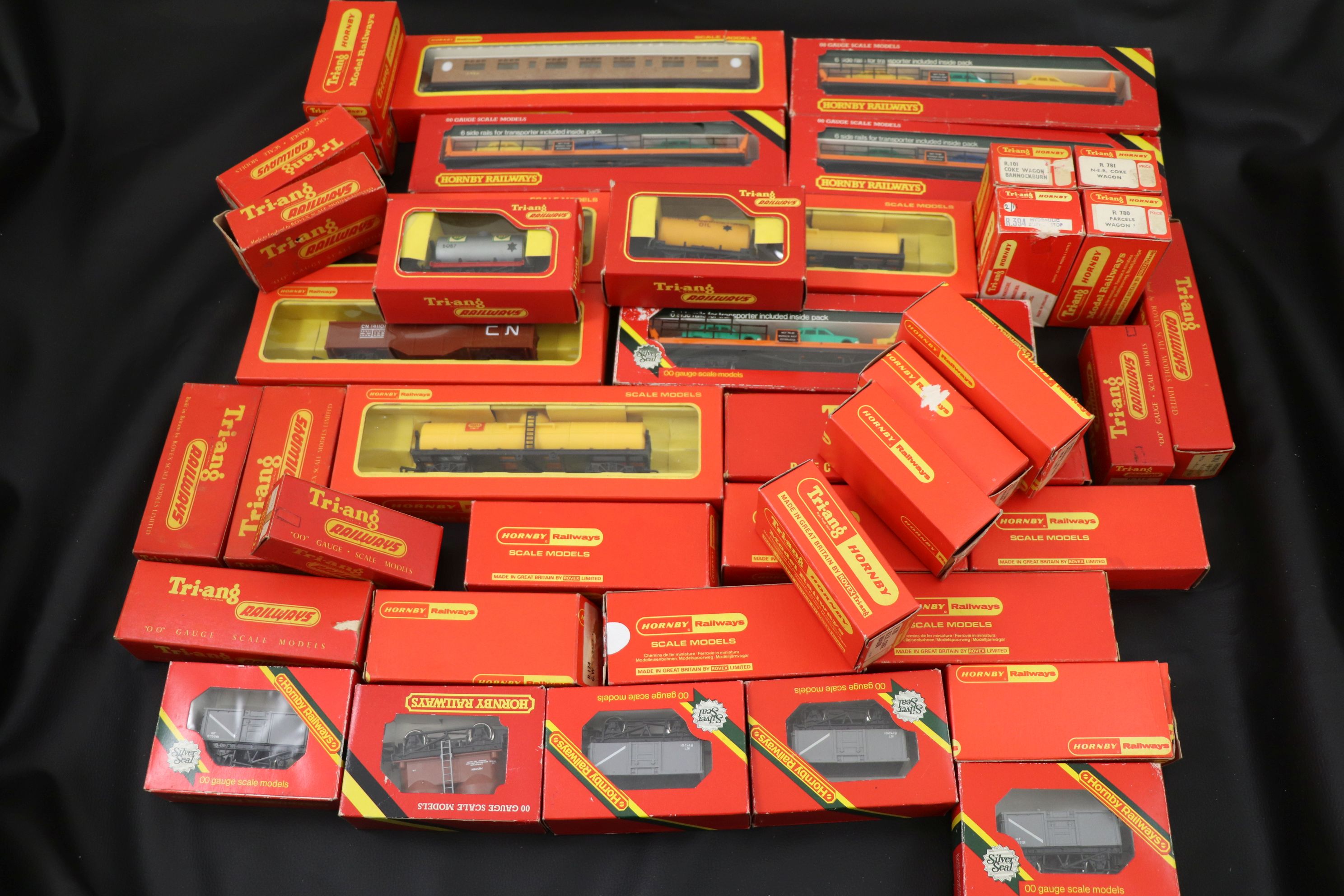 42 Boxed Hornby & Triang OO gauge items of rolling stock to include trucks, wagons and trucks