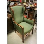 Edwardian Mahogany Inlaid Porter / Wingback Chair, upholstered in green fabric and raised on