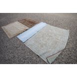 Eastern Wool Rug with Geometric Patterns together with Four Further Rugs and a Rug Cushion