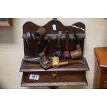 Oak hanging Pipe rack with drawer and a selection of vintage Pipes to include Meerschaum