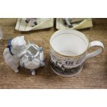 Spode 200th Anniversary of Derby mug and a Continental ceramic model of a cat with floral basket