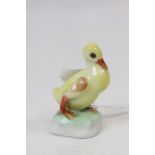 A Herend hand painted yellow duck, height approximately 7cm, impressed mark and blue stamp to base