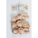 Three plaster of paris small baby dolls with free-moving arms and legs, height approximately 11cm