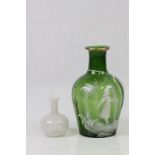 A Victorian Mary Gregory green glass vase with white enamelled garden scene of girl with bird,