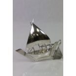 A silver model of a Chinese junk