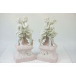 Pair of Bisque ceramic lamp bases depicting Children kissing