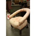 Victorian Tub Chair with upholstered back rail and seat raised on bobbin supports and castors