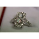 A silver and opal panelled Art Deco style ring