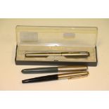 Three Parker fountain pens comprising Parker 45, silvered cap, black barrel and gilt clip, Parker 51