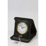 A leather cased early 20th Century travelling clock