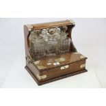 Victorian Oak and Brass Mounted Tantalus with drawers and cut glass decanters by Lloyd, Payne and