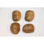 Four vintage carved hardwood African head buttons