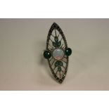 A silver Art Nouveau style ring set with marcasites, emeralds and central opal panel