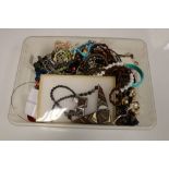 A box of costume jewellery to include brooches, necklaces, bracelets and bangles, rings, wooden