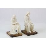 Pair of seated Alabaster figures, a Fisherman and his Wife