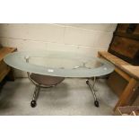 Contemporary Oval Glass Top Table with Curved Chrome Base and Curved Wooden Under Shelf and Wooden