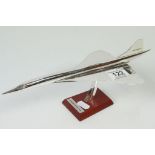 Chrome plated model of Concorde on Wooden base with plaque reading "Aerospace Concorde 1969"