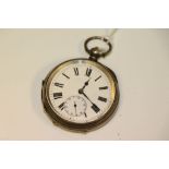A silver open face pocket watch, white face and subsidiary dial, black Roman numerals and hands,