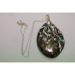 An unusual silver squid pendant necklace on abalone shell with freshwater pearls